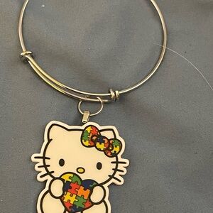 Hello Kitty Silver Bracelet with Puzzle Charm
